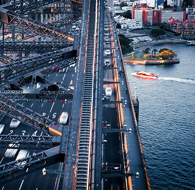 Harbour bridge with vehicles and sea vehicles