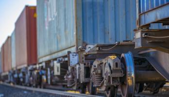 Freight train with containers on tracks