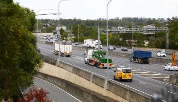 Trucks and cars on city freeway