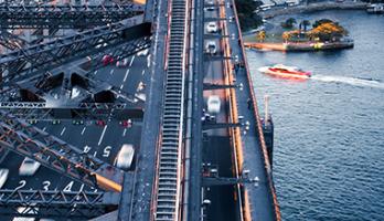 Harbour bridge with vehicles and sea vehicles